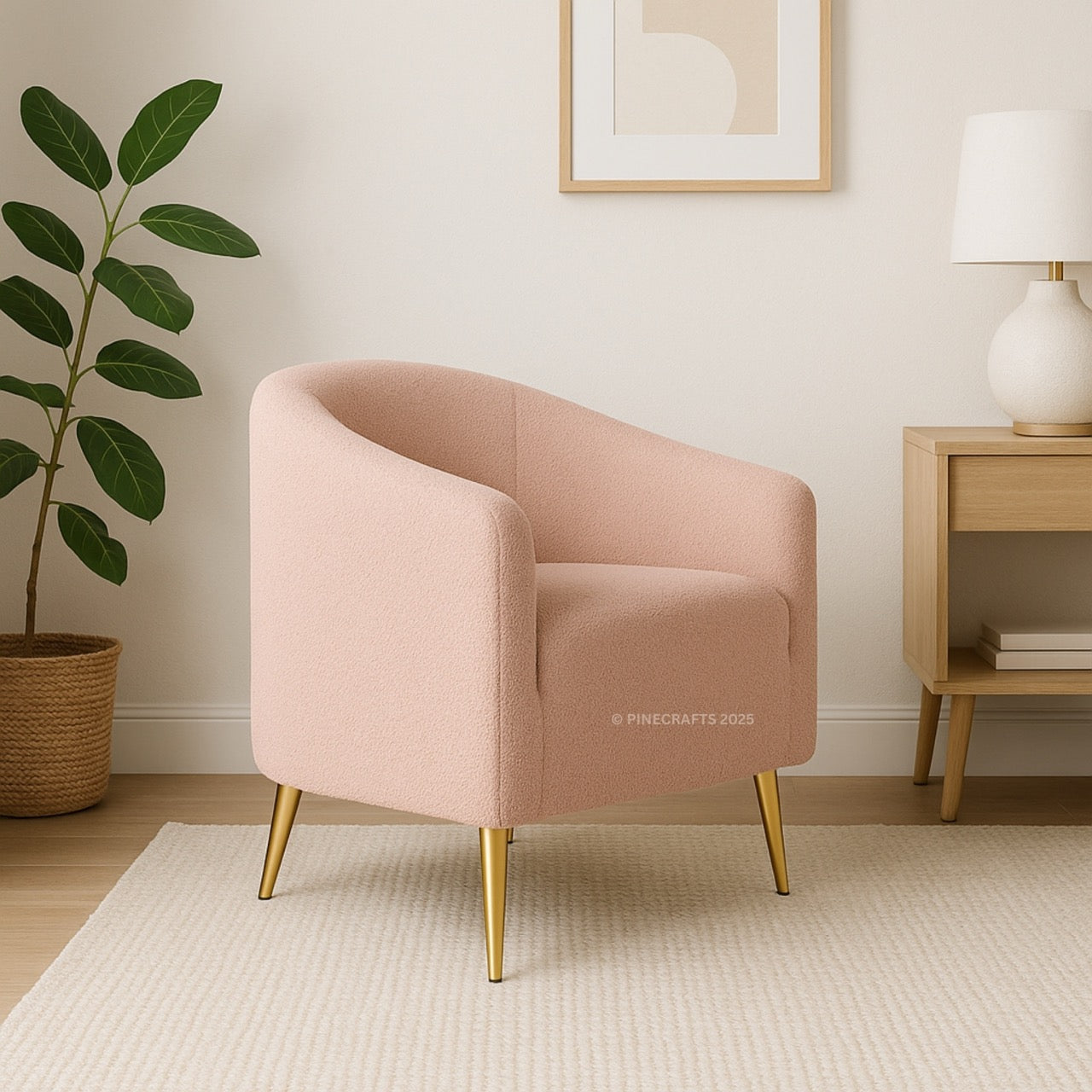 Pink armchair with gold legs in a room with a plant and side table.